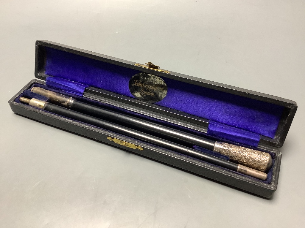 A George V silver mounted ebonised conductors baton in case, 45.3 cm.